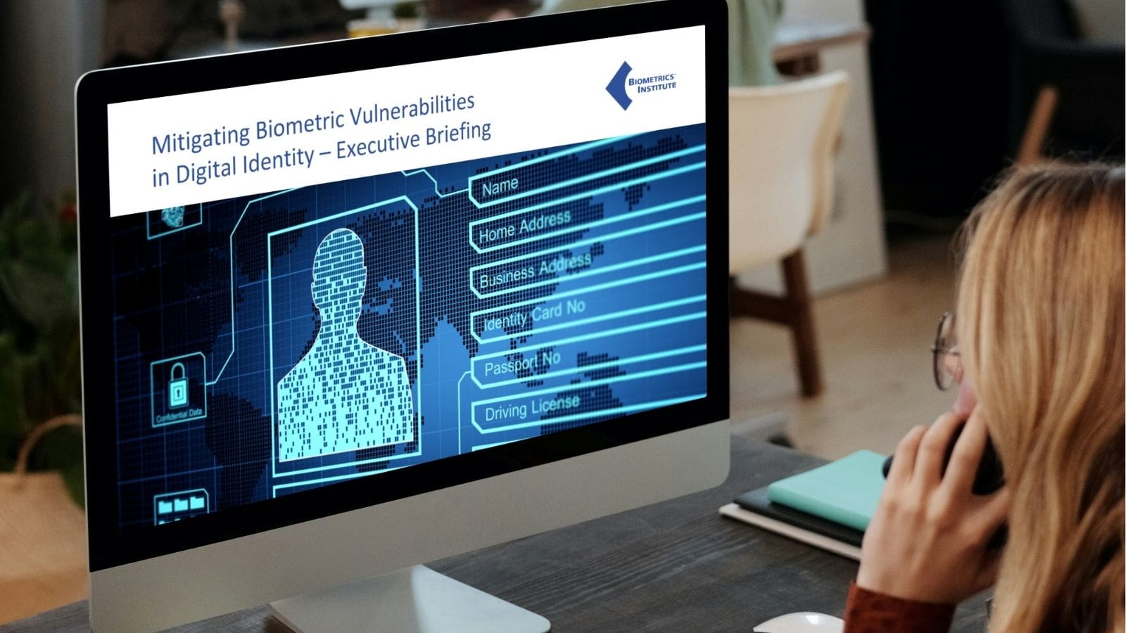 Woman viewing an executive briefing on how to mitigate biometric vulnerabilities