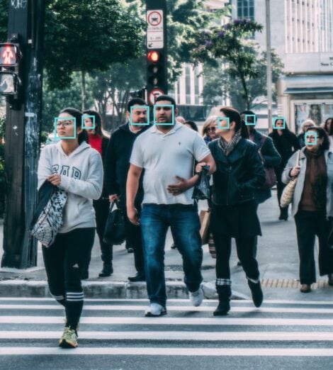 People in public being surveilled by face recognition technology